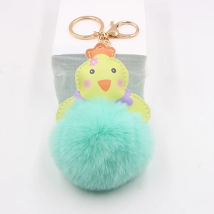 Porte-clés poussin jaune en peluche avec grosse boule de fourrure cyan et anneau