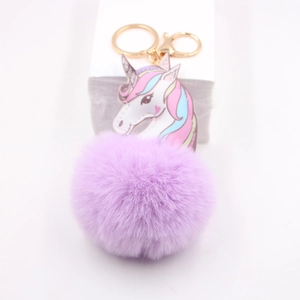 Purple unicorn pom-pom keychain with gold lobster clasp and plush faux fur charm