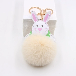 Cute white bunny plush keychain with a beige faux fur ball and gold metal clasp