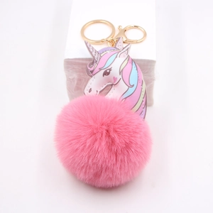 Pink plush unicorn keychain with gold lobster clasp and colorful pattern charm for bags