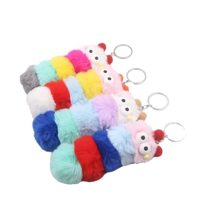 Colorful plush caterpillar keychain with soft furry spheres and metal ring fastener