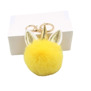 Porte-clés licorne en peluche jaune avec corne dorée et fermoir mousqueton doré