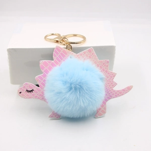 Pink and blue plush dinosaur keychain with golden hook and artificial fur ball charm
