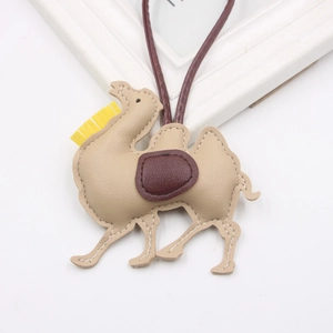 Detailed view of a handmade desert camel PU leather pendant with tassel and lanyard