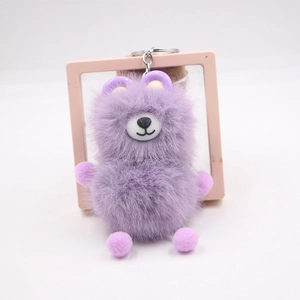 Detailed view of a purple plush bear keychain with soft fur and silver metal ring