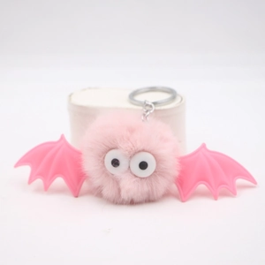 Cute pink plush bat keychain with fluffy fur ball and moving wings for Halloween