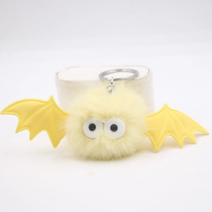 Cute Halloween yellow plush bat keychain with fluffy pompom wings and large eyes