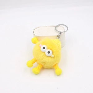 Porte-clés monstre en peluche jaune rigolo avec grands yeux et membres à ressort