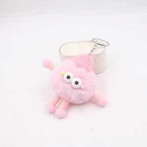 Porte-clés monstre en peluche rose avec jambes à ressort et bonnet en tricot pour sacs