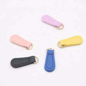 Five assorted PU leather zipper pulls with gold metal rings for DIY phone case accessories
