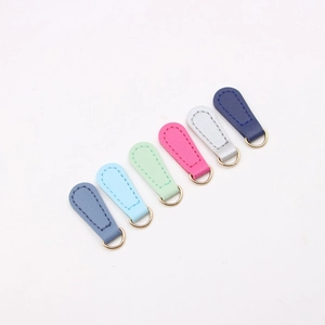 Macro detail of PU leather zipper pulls with gold D-rings in six various colors