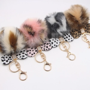 Faux fur pompom keychain with leopard print bow and gold clip in four colors