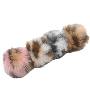 Set of four faux fur leopard print pom pom keychains with gold metal clips and fluffy texture
