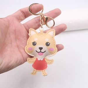 Porte-clés Shiba Inu mignon en cuir avec robe rouge et fermoir doré pour sacs à dos