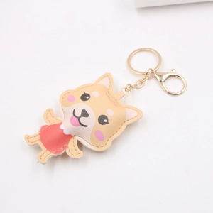 Détail d'un porte-clés Shiba Inu en cuir PU avec fermoir doré pour sacs et accessoires