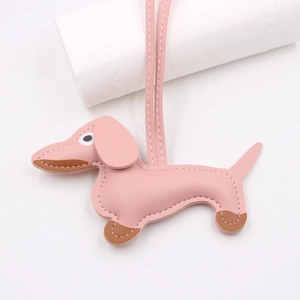Detailed stitching on pink leather dachshund dog keychain with brown accents