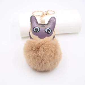 Portachiavi gatto creativo con pompon in peluche marrone e ciondolo gatto in pelle viola