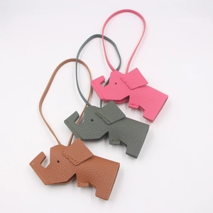 Litchi pattern leather elephant bag charms in pink, green, and brown with hand stitching