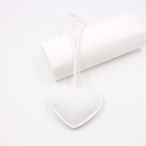 Minimalist white heart leather bag charm with stitched edges and matching lanyard