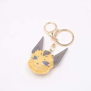 Cute caracal leather keychain in yellow and grey with golden lobster clasp and ring