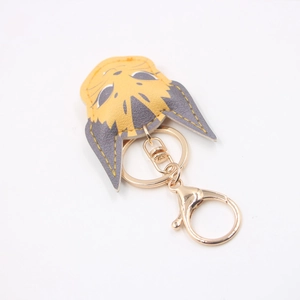 Cute yellow and grey leather cat keychain with golden metal clasp and ring attachment