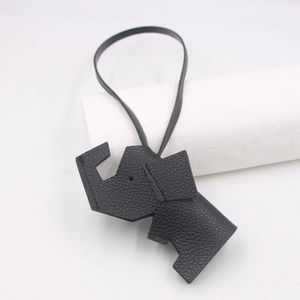 Detail of black litchi grain PU leather elephant charm with matching lanyard strap