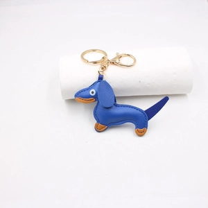 Detailed blue leather dachshund keychain with golden ring and fine stitching detail