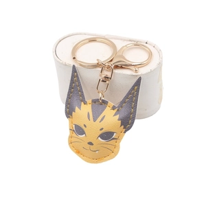 Cute caracal cat leather keychain with gold lobster clasp on white jewelry box