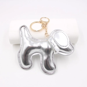 Silver leather puppy bag charm with gold hardware for keychains and accessories