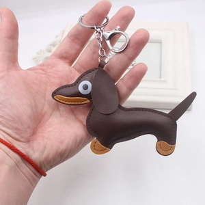 Brown leather dachshund dog keychain with silver lobster clasp and decorative stitching