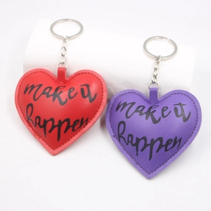 Red and purple heart PU leather keychains with make it happen print and metal ring
