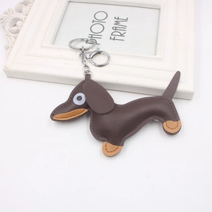 Detail of leather dachshund keychain featuring fine stitching and sturdy metal lobster clasp