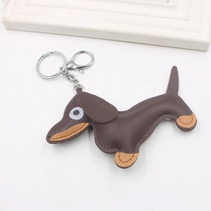 Brown leather dachshund dog keychain with silver metal ring and lobster clasp on white background