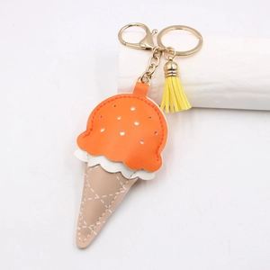 Detail of creative ice cream leather keychain with white cross-stitched cone and gold clasp