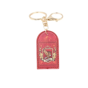 Red textured PU leather keychain with golden eagle crest and Excellence emblem on white back