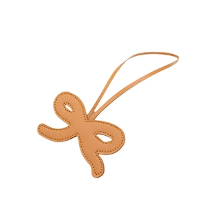 Brown leather bow keychain with contrast stitching for bags and key decoration