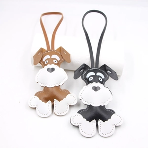 Leather Schnauzer dog bag charm pendants in brown and black colors with white stitching