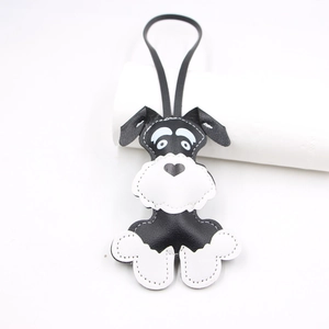Handmade leather Schnauzer dog charm with black and white stitching and heart-shaped nose