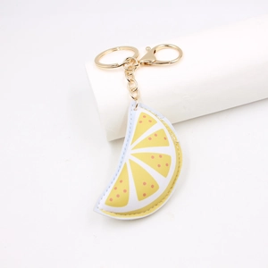 Portachiavi creativo in pelle PU a fetta di limone con anello in metallo dorato