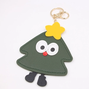 Cute green leather Christmas tree bag charm with googly eyes and gold keychain