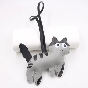 Cute grey leather cat bag charm with black stripes and matching thin strap for handbags