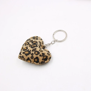 Plush heart-shaped leopard print keychain with silver metal ring on white background