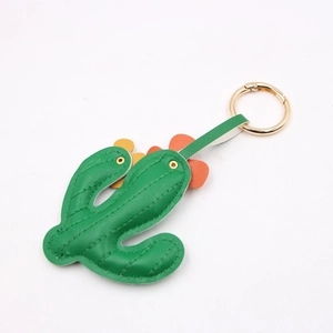 Green leather cactus keychain pendant with colorful flowers and golden metal ring