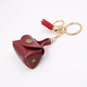 Mini portamonete portachiavi in pelle bordeaux con fibbia dorata e dettaglio nappa