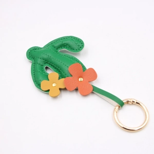 Creative green leather cactus bag charm with yellow and orange flowers and gold key ring