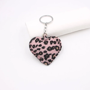 Pink leopard print fabric heart keychain with silver metal ring and chain detail
