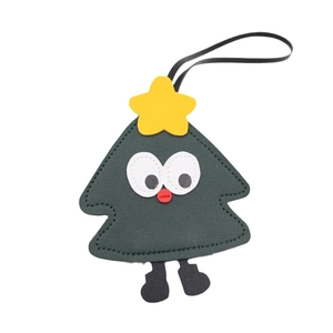 Cute cartoon Christmas tree leather keychain with star and smiling face on white background