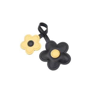 Floral leather bag charm in black and yellow contrast with stitched flower petal detail
