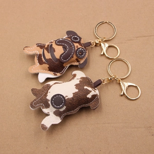Creative faux leather pug dog keychains in brown and spotted patterns with gold hardware