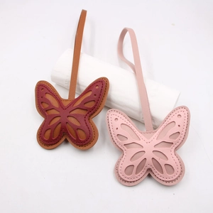 Hollow leather butterfly keychain bag charm in brown and pink multi-layer design